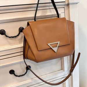 A new brown bag in a very good condition but with no tags.